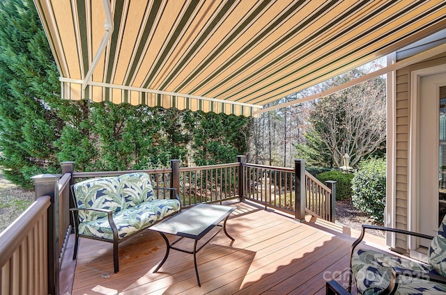 wooden deck featuring an outdoor living space