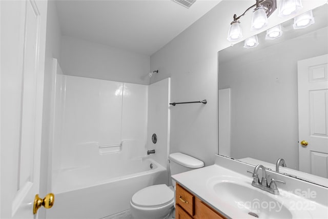 bathroom featuring toilet, bathtub / shower combination, and vanity