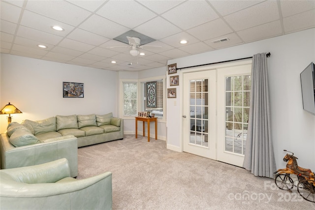 living room featuring recessed lighting, a ceiling fan, visible vents, and carpet floors