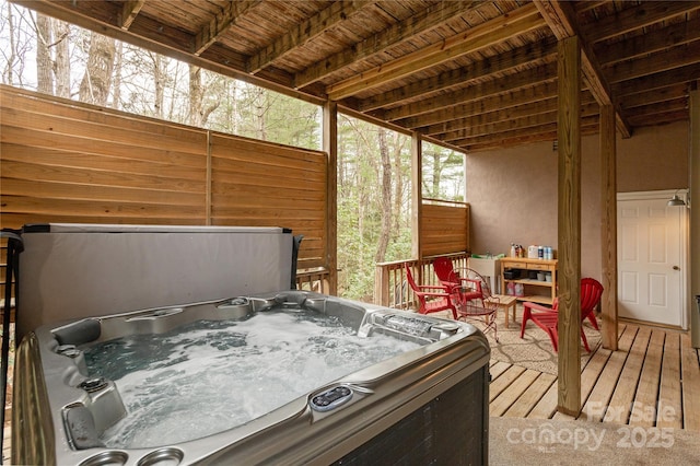 wooden terrace featuring a hot tub