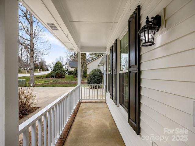 balcony featuring a porch