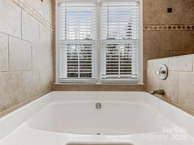 bathroom with a garden tub