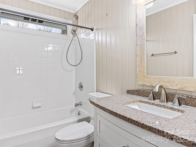 bathroom with vanity, toilet, crown molding, and shower / bathing tub combination