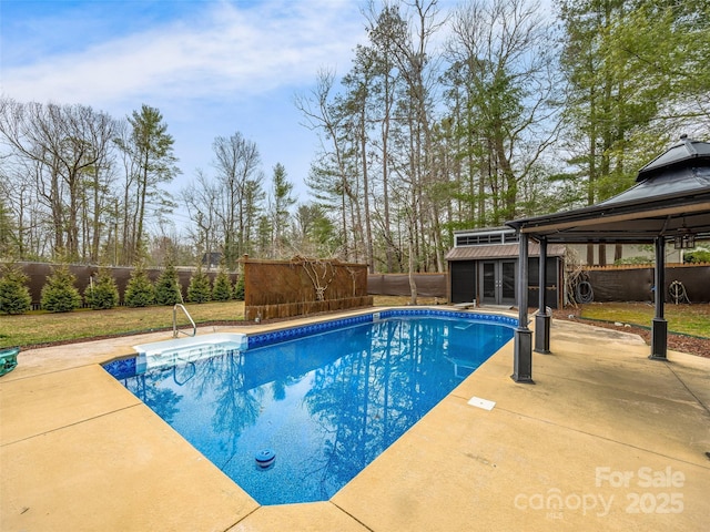 view of pool featuring a fenced in pool, a patio, an outdoor structure, and a fenced backyard