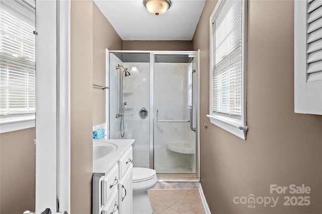 full bath featuring toilet, a stall shower, vanity, and tile patterned flooring