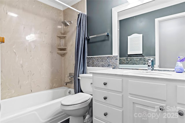 bathroom featuring tile walls, vanity, toilet, and shower / tub combo