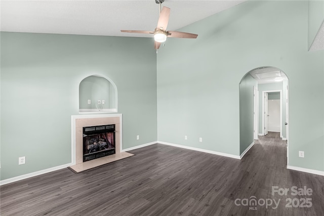 8421 Kings Creek Dr, Charlotte, NC 28273 - unfurnished living room featuring a premium fireplace, baseboards, a ceiling fan, and dark wood-style flooring