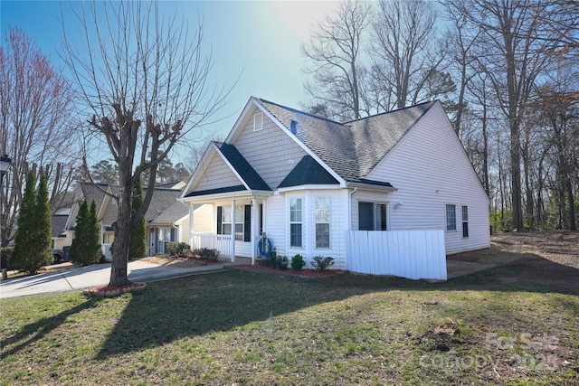 8421 Kings Creek Dr, Charlotte, NC 28273 - view of front of property featuring a porch, a shingled roof, a front yard, and concrete driveway