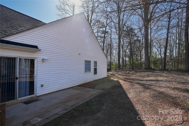 8421 Kings Creek Dr, Charlotte, NC 28273 - view of property exterior featuring a patio area and a shingled roof