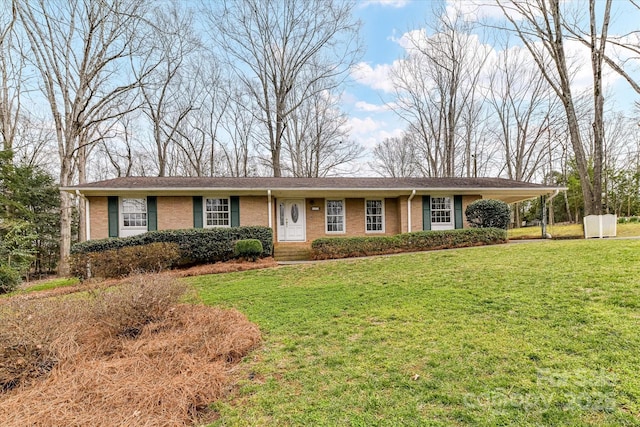 single story home with brick siding, a carport, and a front yard