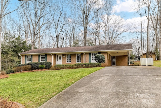 ranch-style house featuring brick siding, driveway, an attached carport, and a front lawn