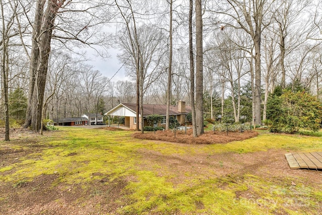 view of yard with a carport