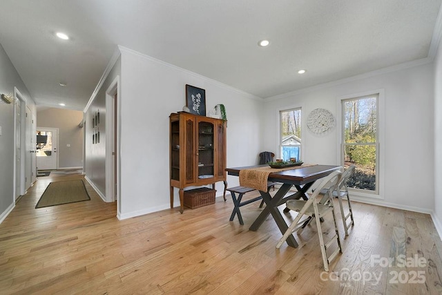 dining area featuring light wood finished floors, recessed lighting, and baseboards