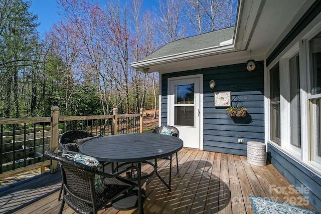 deck featuring outdoor dining area