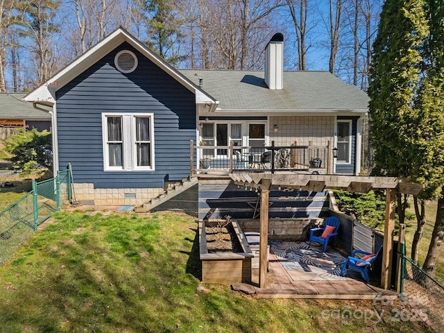 rear view of property with stairway, fence, a yard, a chimney, and a deck