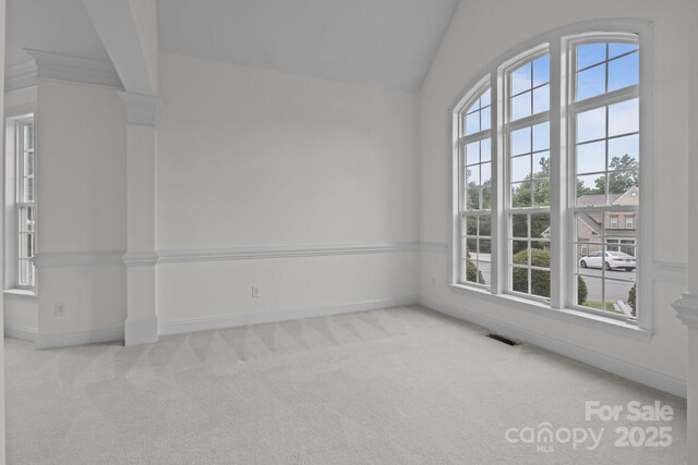 561 Keystone Ct NW, Concord, NC 28027 - spare room featuring carpet, baseboards, and vaulted ceiling