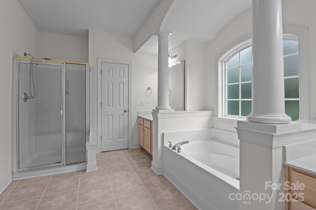 561 Keystone Ct NW, Concord, NC 28027 - bathroom featuring ornate columns, vanity, a shower stall, tile patterned flooring, and a bath
