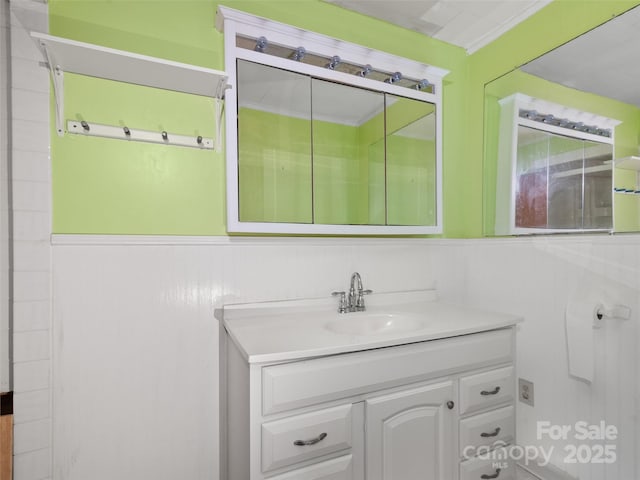 bathroom featuring vanity and wainscoting