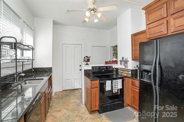 kitchen with black appliances, a healthy amount of sunlight, a peninsula, and a sink