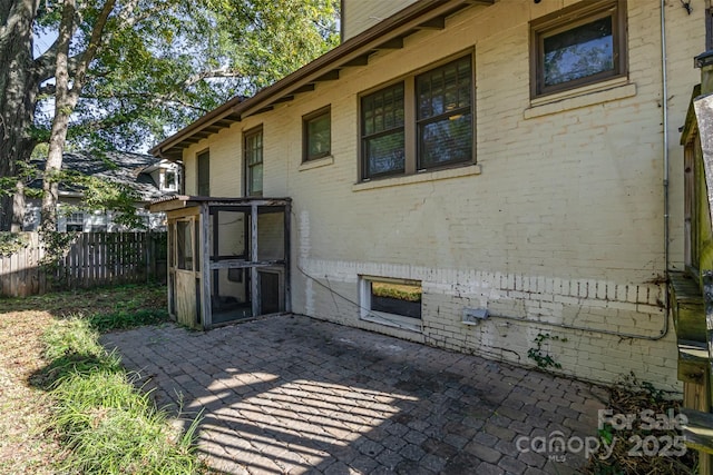 view of patio / terrace featuring fence