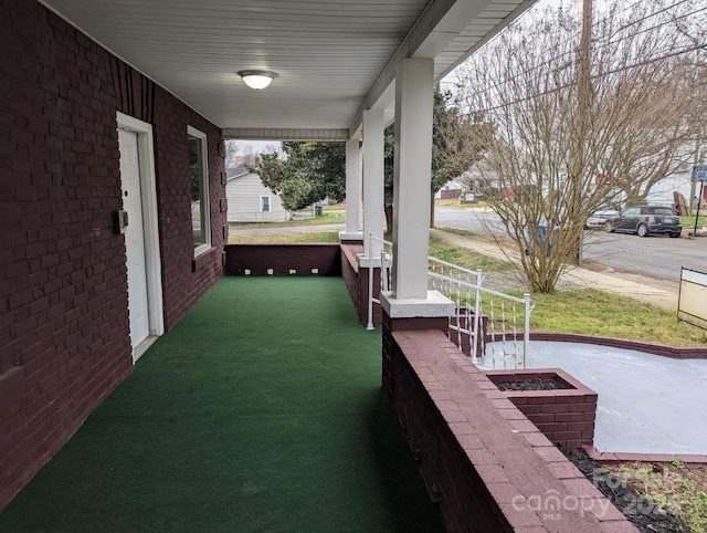 view of patio featuring a porch