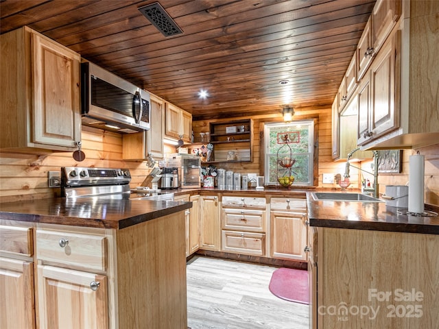 kitchen featuring light brown cabinets, wooden ceiling, light wood-style floors, stainless steel appliances, and a sink