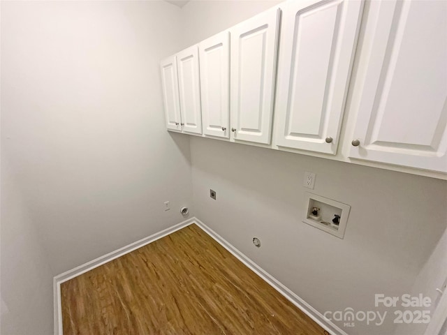 laundry room with baseboards, washer hookup, hookup for a gas dryer, cabinet space, and electric dryer hookup