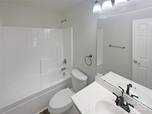 bathroom featuring vanity, toilet, and shower / bathtub combination