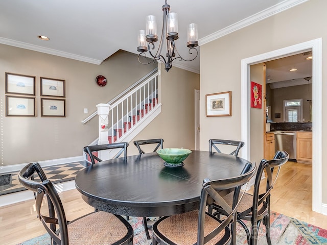 dining area featuring crown molding, stairway, a chandelier, light wood-style flooring, and baseboards