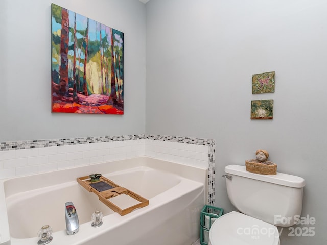 bathroom with a bath and toilet