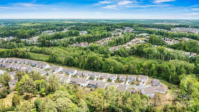 bird's eye view featuring a residential view and a view of trees