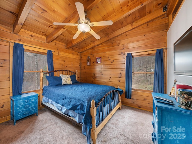 bedroom featuring a ceiling fan, carpet floors, wooden walls, wood ceiling, and vaulted ceiling with beams