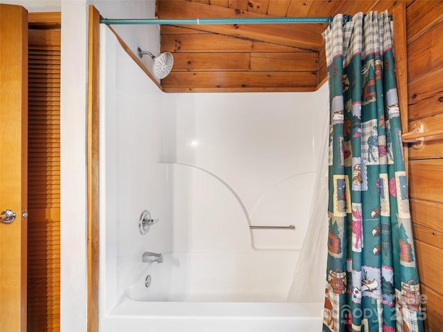 full bathroom with vaulted ceiling, wood ceiling, and shower / tub combo with curtain