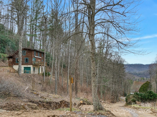 view of yard featuring a view of trees