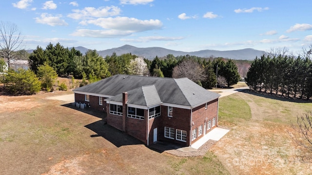 birds eye view of property with a mountain view