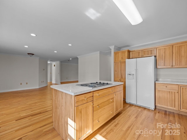 kitchen with stainless steel electric cooktop, white refrigerator with ice dispenser, light wood-style flooring, and ornamental molding