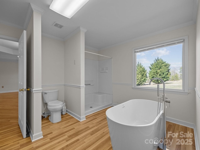 bathroom with wood finished floors, visible vents, a soaking tub, walk in shower, and toilet