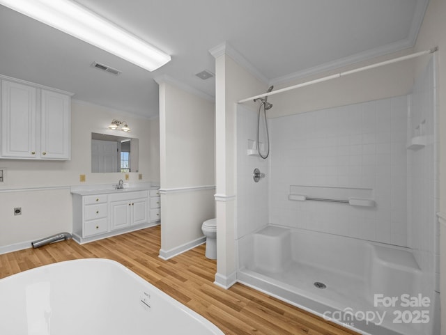 full bathroom featuring visible vents, wood finished floors, and ornamental molding