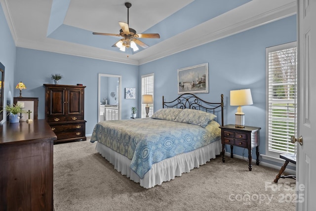 bedroom featuring baseboards, ceiling fan, crown molding, light carpet, and a raised ceiling