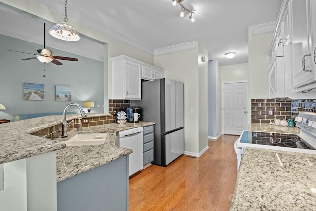 kitchen with a ceiling fan, a sink, white cabinetry, white appliances, and light wood finished floors