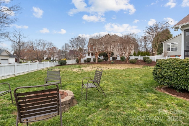 view of yard featuring an outdoor fire pit and a fenced backyard