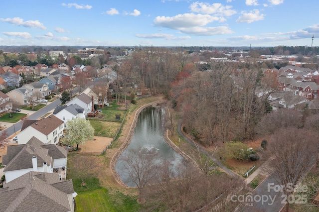 bird's eye view with a residential view and a water view