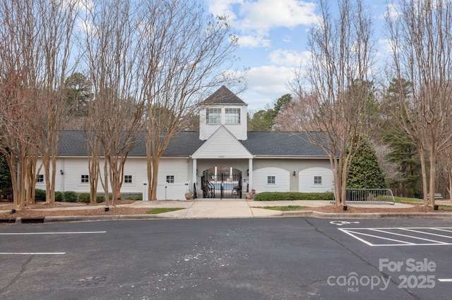 view of property featuring uncovered parking