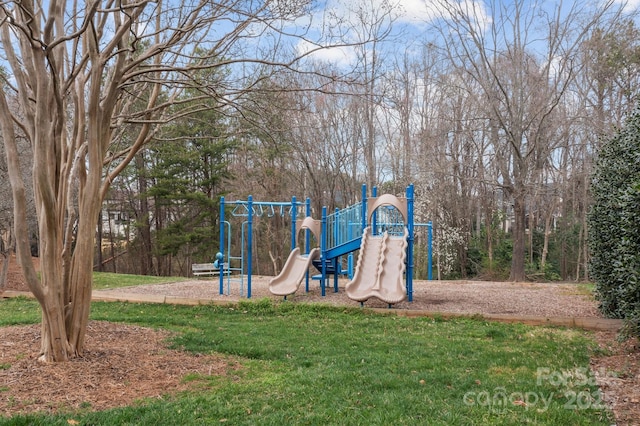 community playground featuring a lawn