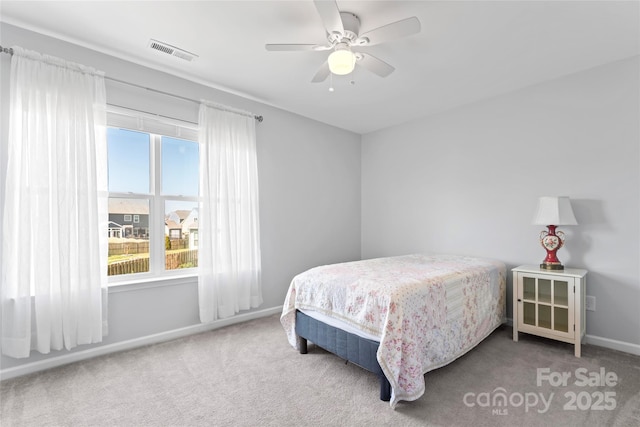 bedroom featuring a ceiling fan, carpet, visible vents, and baseboards