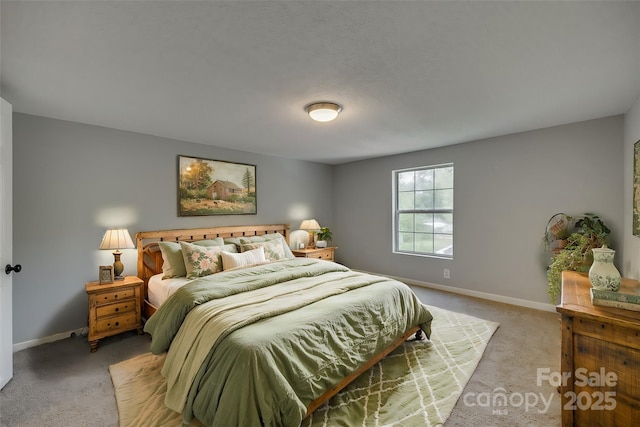 bedroom featuring baseboards and light carpet