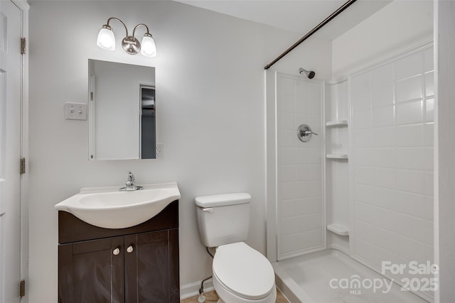 bathroom featuring a shower, toilet, and vanity