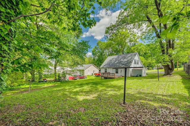 view of yard with a wooden deck