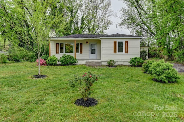 110 Maplewood Knoll Dr, East Flat Rock, NC 28726 - ranch-style house with a chimney and a front yard