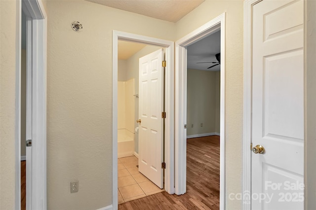 110 Maplewood Knoll Dr, East Flat Rock, NC 28726 - corridor featuring baseboards and light wood-type flooring